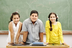 Three children in classroom